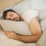 sleeping man on the bed
